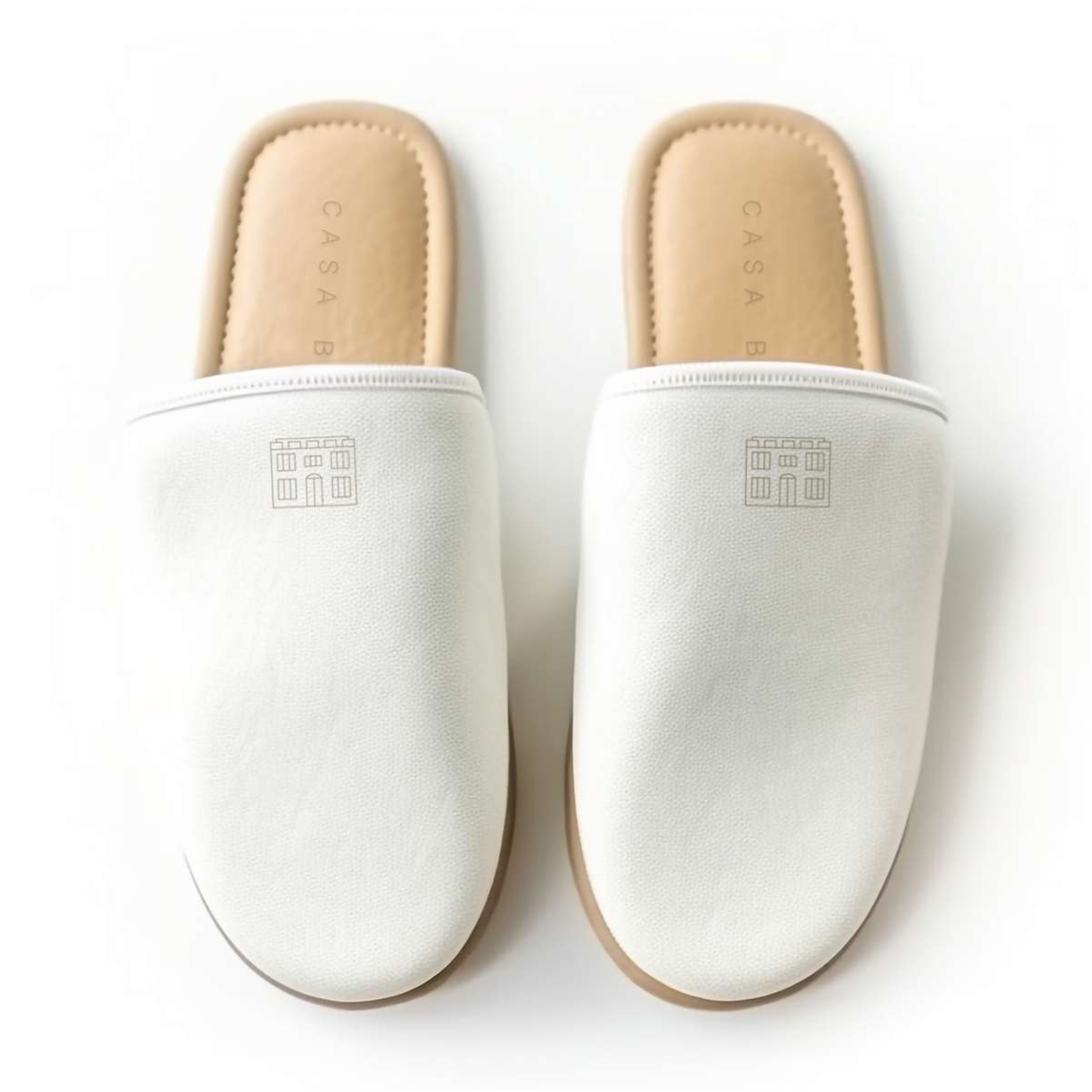 Casa Bianca branded hotel slippers — top-down view