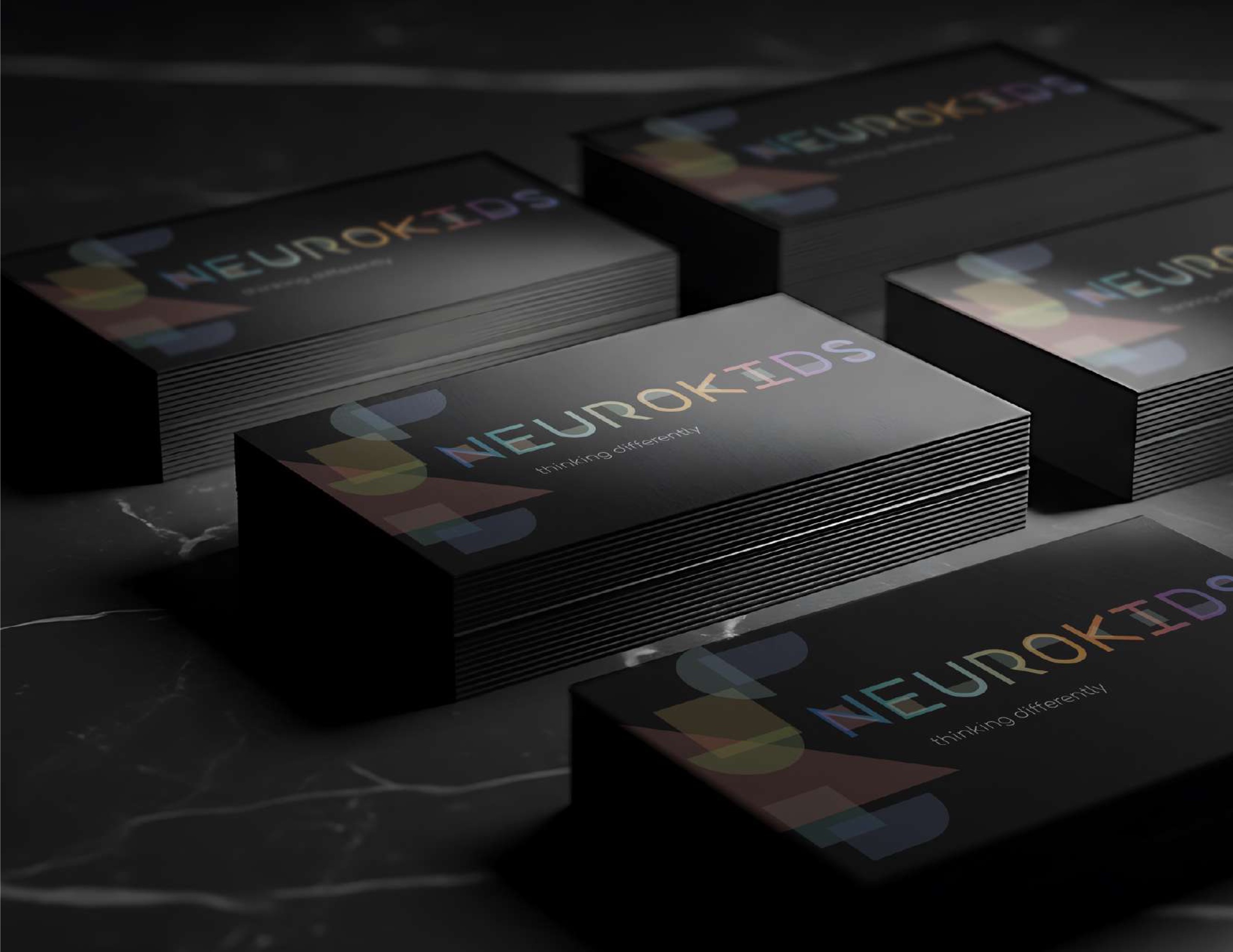 Neurokids 2023 business cards on marble
