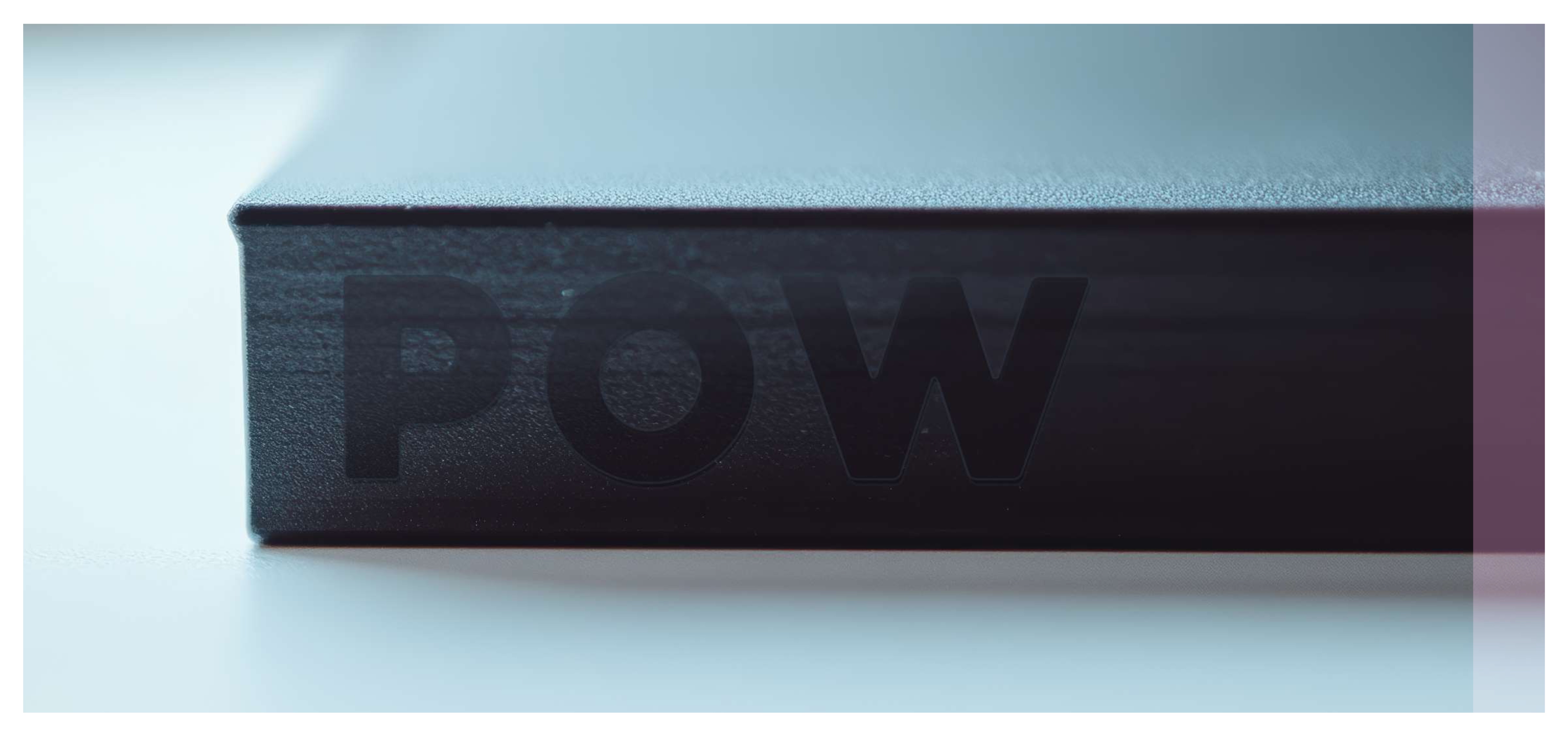 POW brand book — cover close-up, embossed logo on black