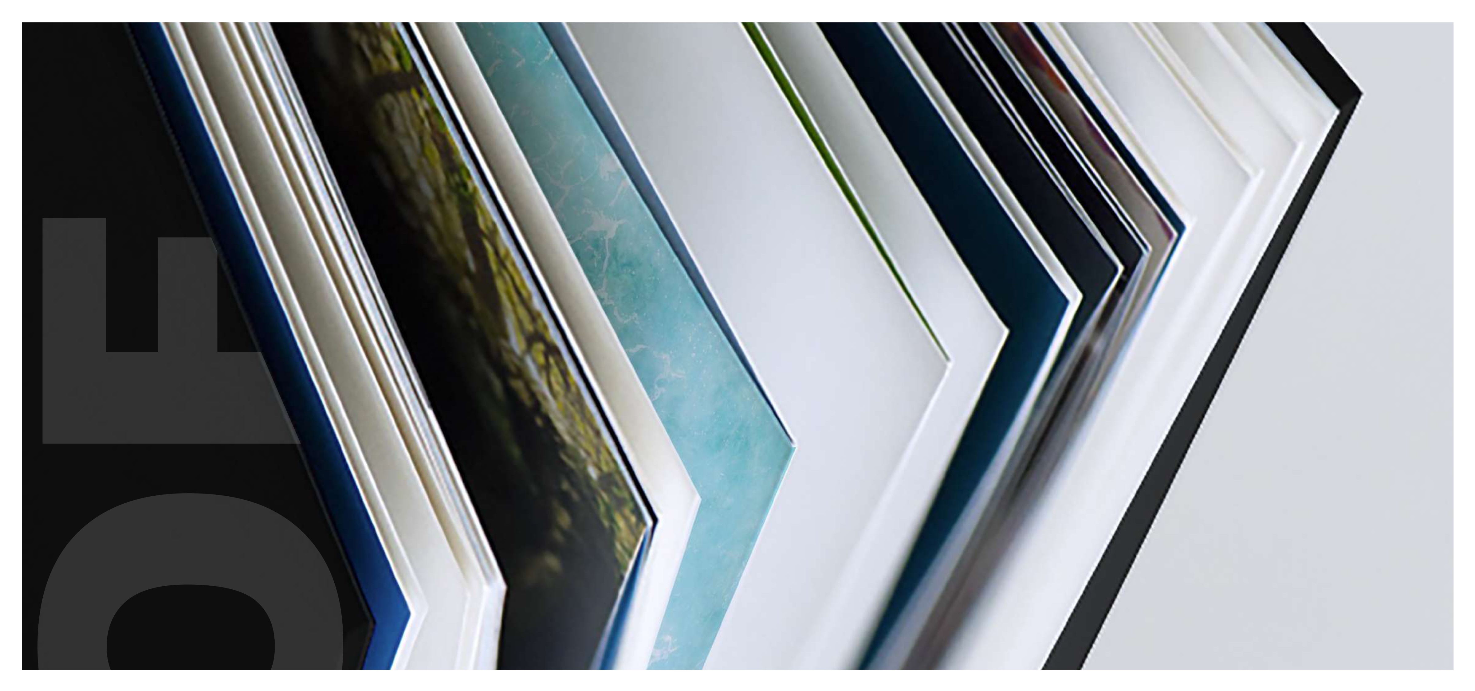 POW brand book pages fanned open, revealing editorial spreads